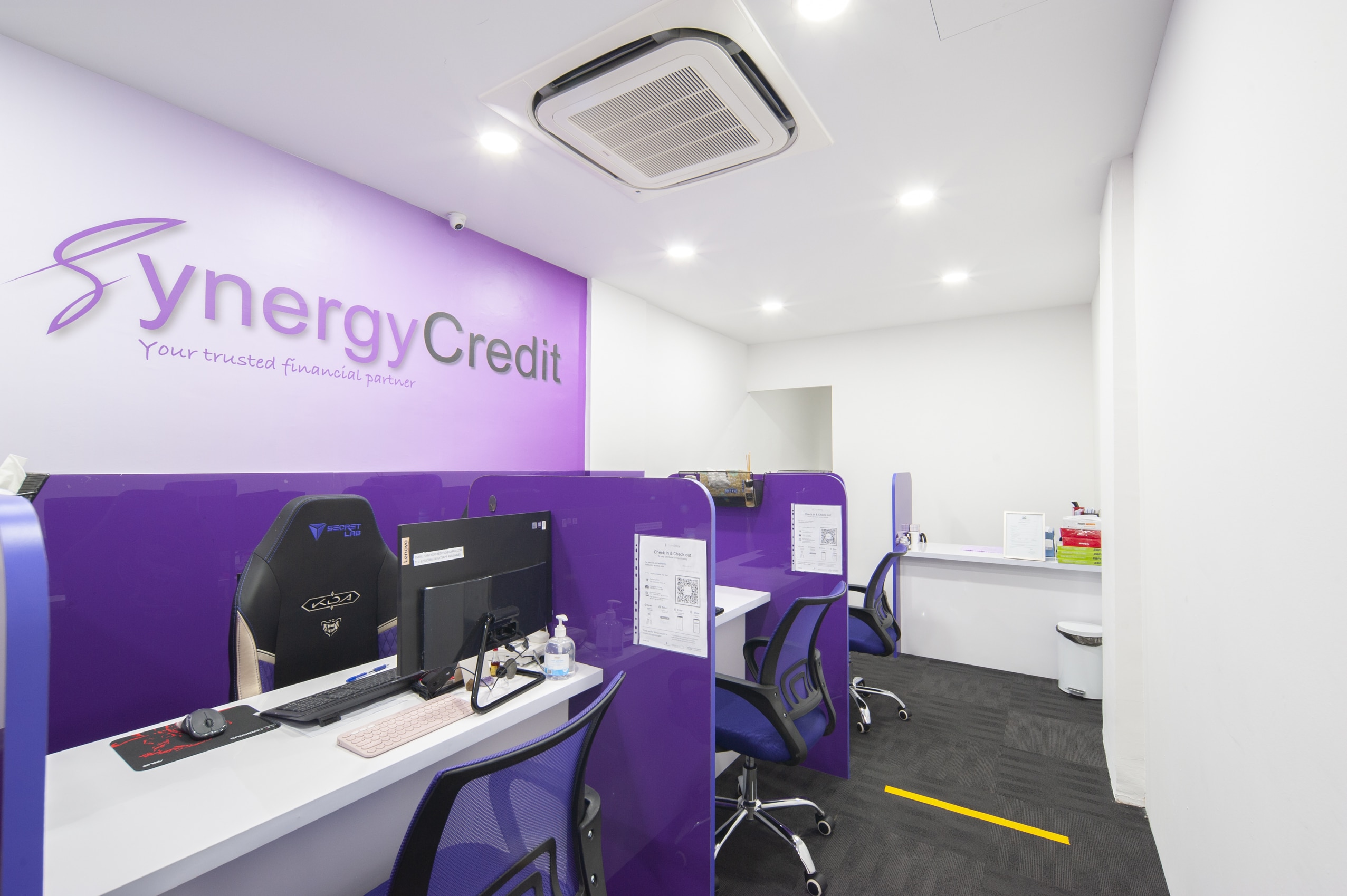 Loan officers' counters at Synergy Credit's licensed money lender office in Singapore