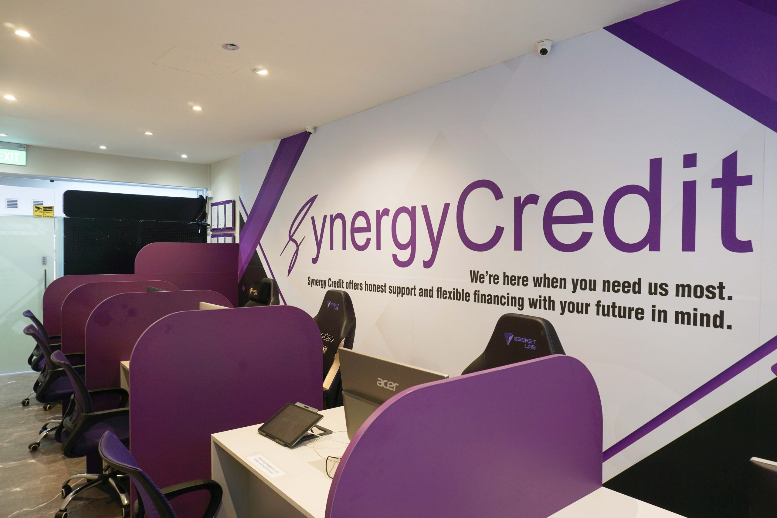 Loan officers' counters at Synergy Credit's legal money lender office in Clementi